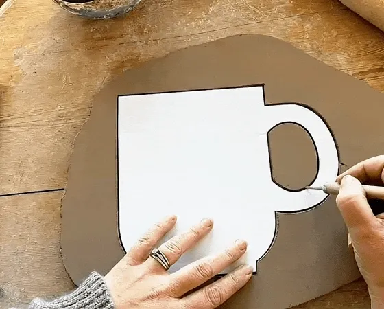Applying a template to fresh clay